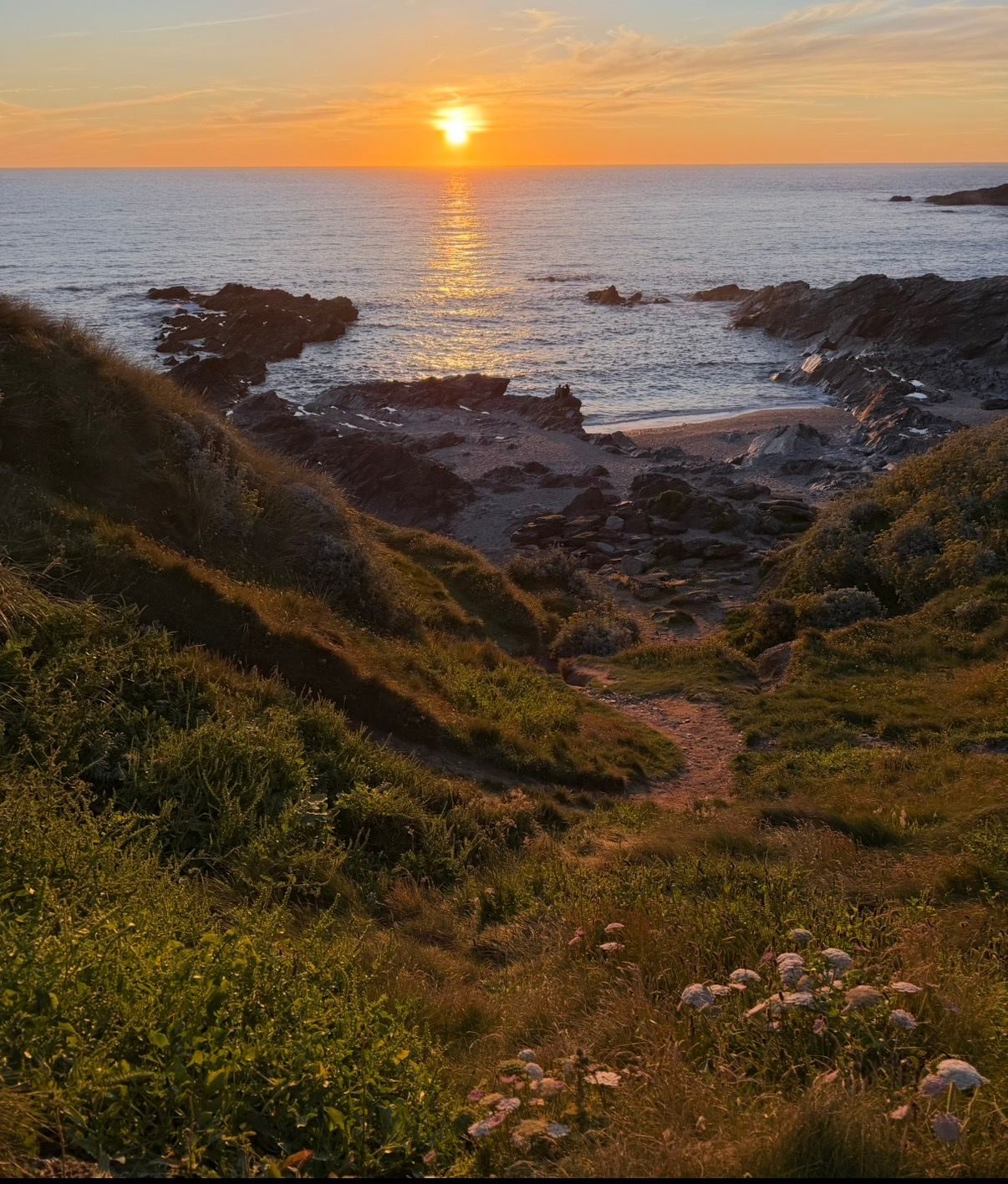 Path down to a Cornish beach at sunset